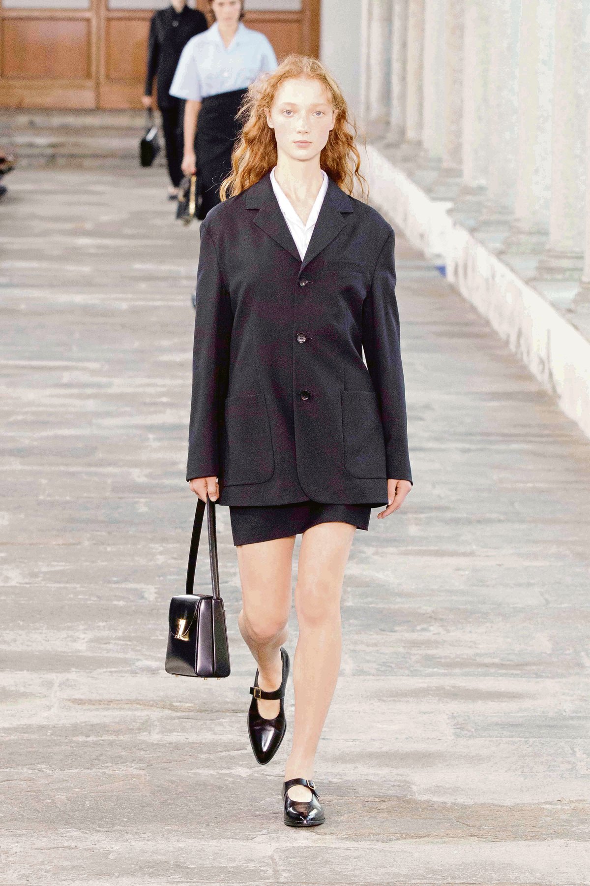 SINGLE-BREASTED jacket in black wool.